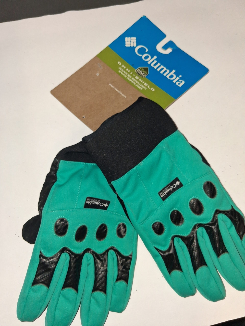 Columbia Omni-Shield teal and black outdoor gloves featuring textured grip palms